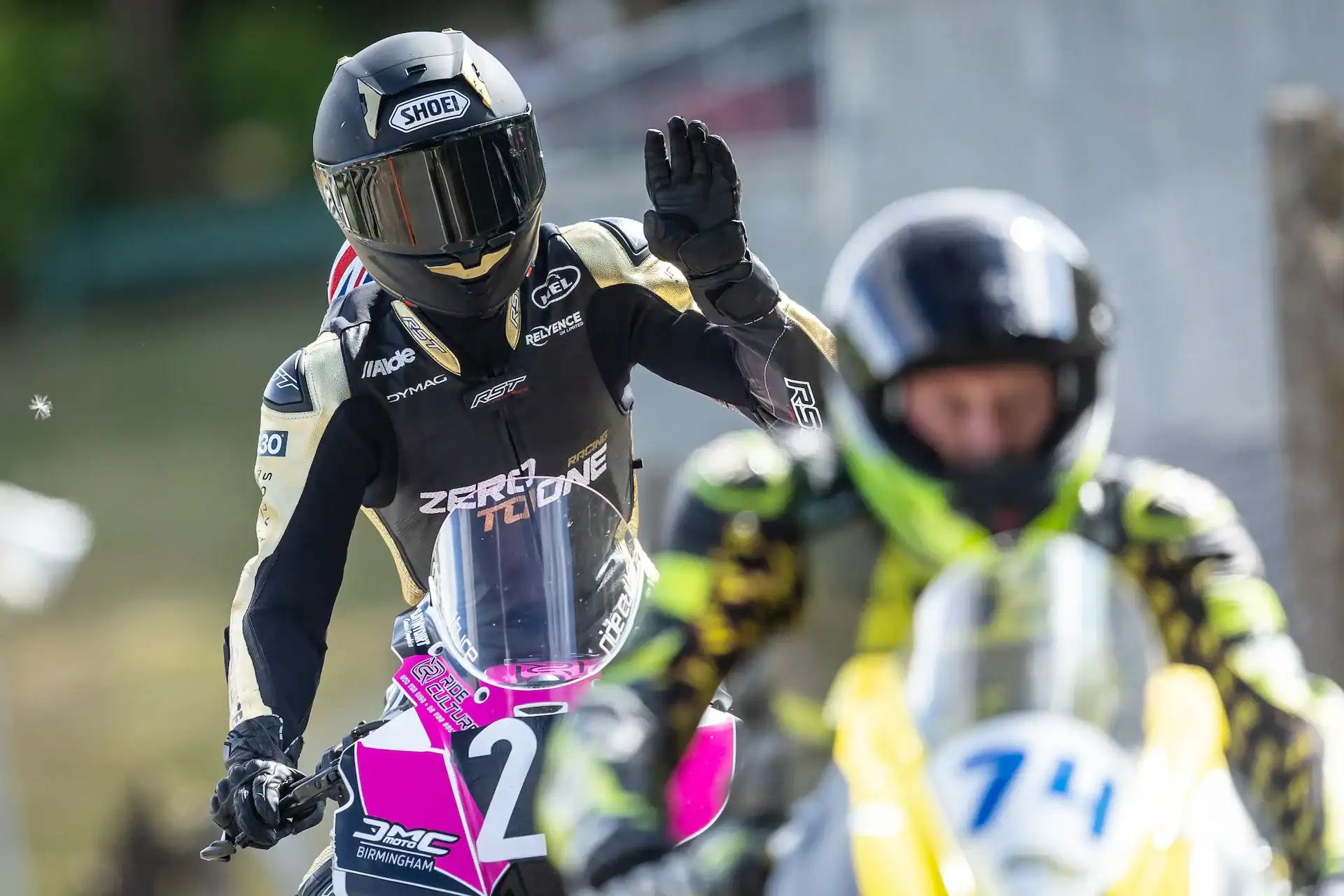 Evan Brailsford waving after racing the Ride Culture Racing KTM 990RCR at Cadwell Park
