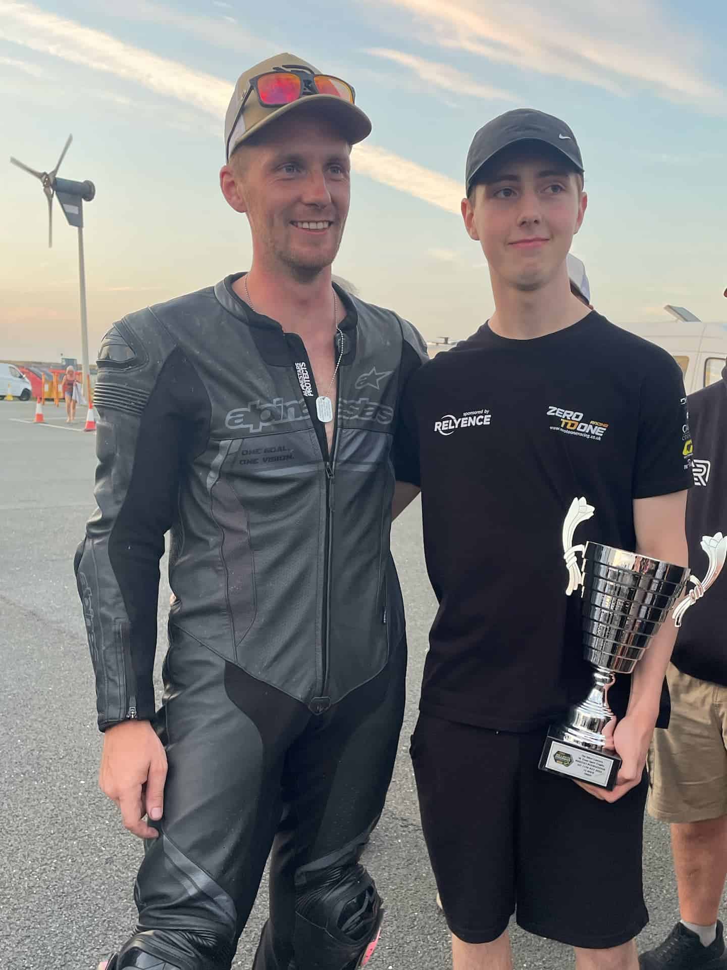 Evan holding the trophy with a Ride Culture Racing teammate after the Anglesey 12 Hour Endurance