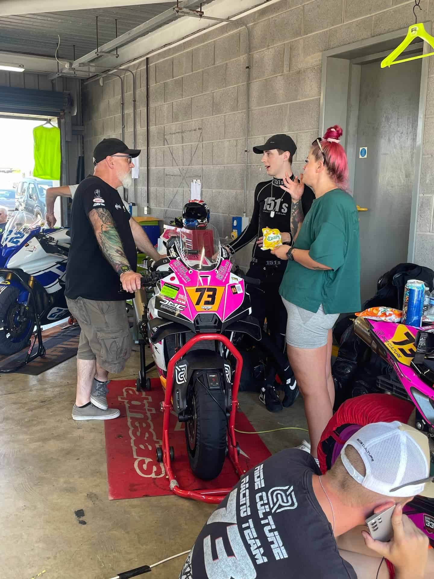 Ride Culture Racing's KTM 990 RCR and team in the garage at Anglesey