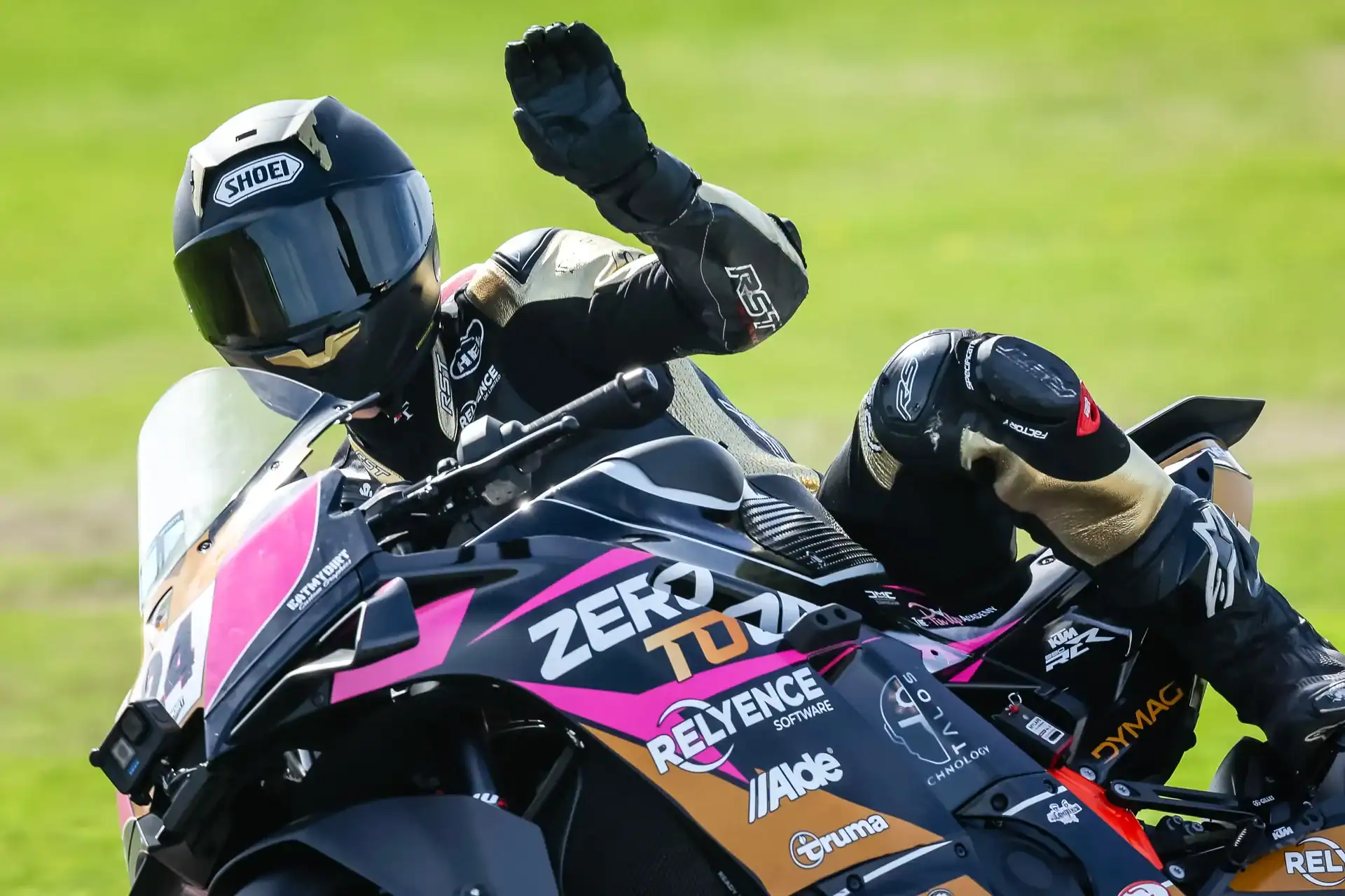 RND 8 Anglesey Coastal 3 Evan Brailsford raising a hand from the number 24 KTM 990 RC R at the end of Race 15 at Anglesey.